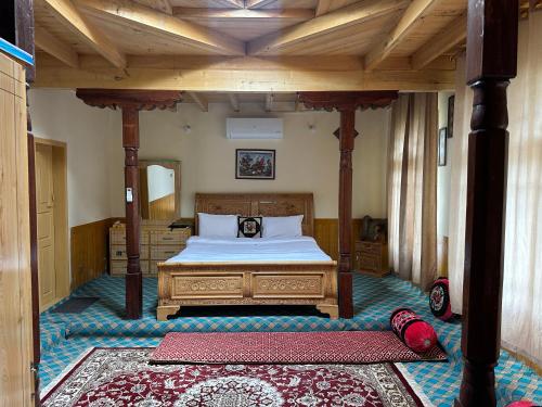 a bedroom with a large bed in a room at KOH E QAF HUNZA in Hini