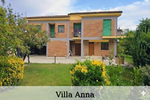 a house in a garden with the title villa amana at Villa Anna - Bike Friendly in Buonconvento