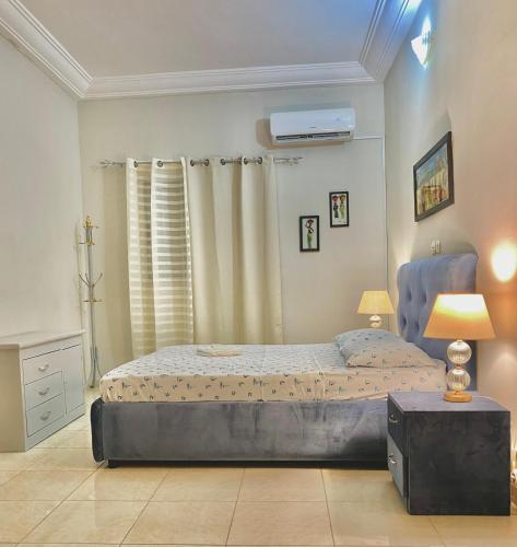 Un pat sau paturi într-o cameră la Résidence NECTAR 2