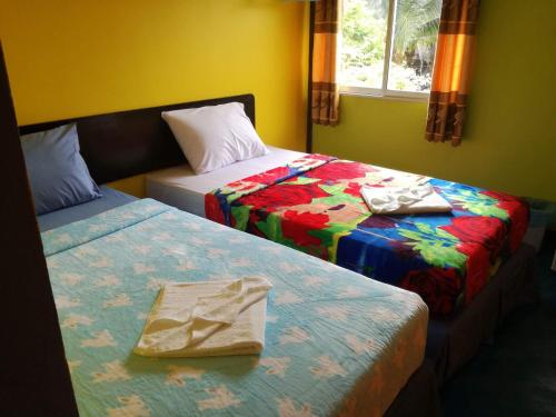Postel nebo postele na pokoji v ubytování Rc Guest House