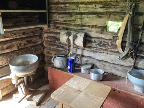 a kitchen with two sinks and a wooden wall at Idyllisk feriested in Gol
