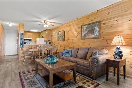 a living room with a couch and a table at Bear Cub Retreat in Gatlinburg