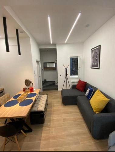 a living room with a couch and a table at San VICENTE in Vigo