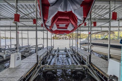 a view from the inside of a metal building with a boat at Family Tides Condo for 8 in Osage Beach