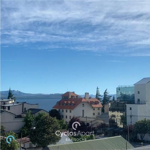 a view of a city with buildings and the ocean at CyclosApart Bariloche in San Carlos de Bariloche