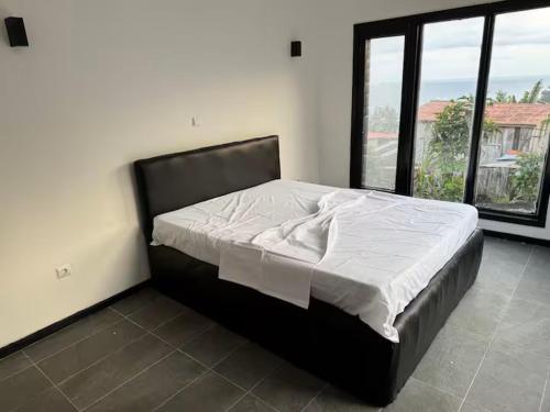 Un pat sau paturi într-o cameră la Villa Sete Ondas