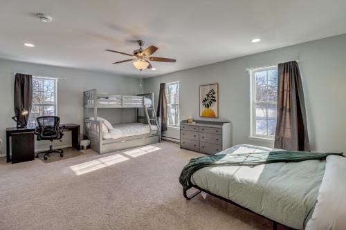 a bedroom with a bed and a ceiling fan at Family Retreat with Game Room, 4 Mi to Kalahari! in Emerald Lakes