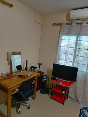 TV a/nebo společenská místnost v ubytování Votre maison