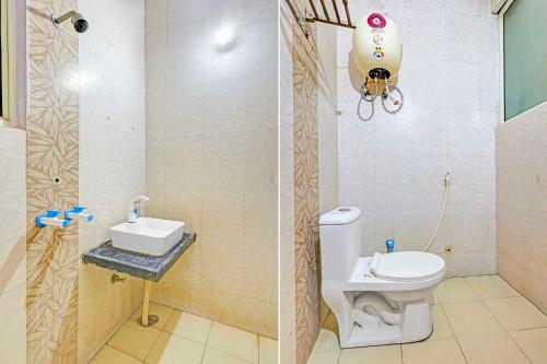 a bathroom with a toilet and a sink and a shower at Collection O Rewari Central Railway Junction in Rewāri