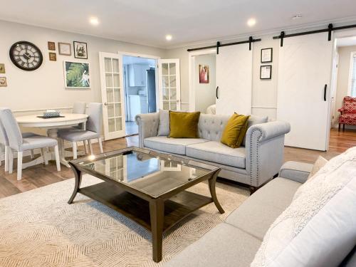 a living room with a couch and a coffee table at Addison House License# 004-2025 in Niagara-on-the-Lake