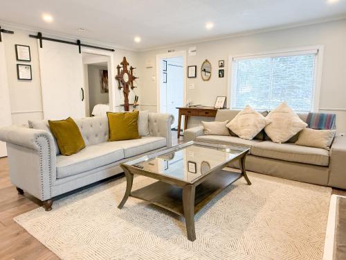 a living room with two couches and a coffee table at Addison House License# 004-2025 in Niagara-on-the-Lake