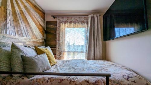 a bedroom with a bed and a window at Perfect Location - 4BD,1BA - Restored Redwood Home in San Francisco