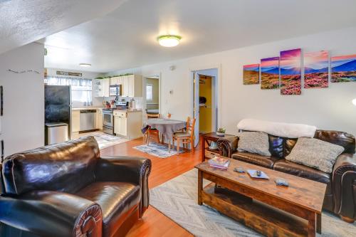 a living room with leather furniture and a table at 2 Mi to Dtwn Cozy Getaway in Fairbanks! in Fairbanks
