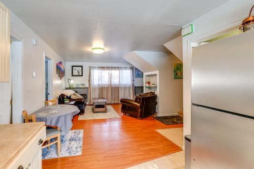 a kitchen and living room with a refrigerator at 2 Mi to Dtwn Cozy Getaway in Fairbanks! in Fairbanks