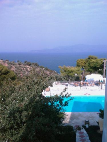 a view of a swimming pool and the ocean at Villa Agnanti Boutique in Grammatiko