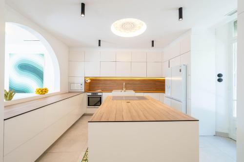 a kitchen with a wooden counter top in a room at Villa Rosoliel in Cannes