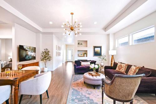 a living room with a couch and a table at Guest Favorite 3BD 2BA Meridian Home for Business & Pleasure in Meridian