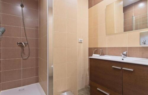 a bathroom with a shower and a sink and a toilet at Apartamentos turísticos Sardon in Sardón de los Frailes