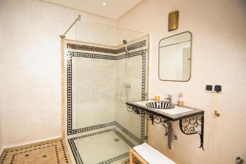a bathroom with a shower and a sink at Villa Dar Saada in Marrakesh