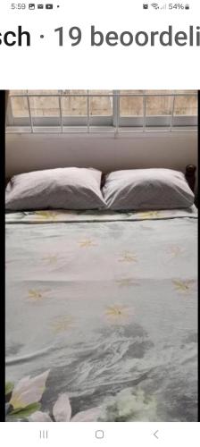 a bed in a room with at Chalet Anna's Pavalesto in Landsboerderij