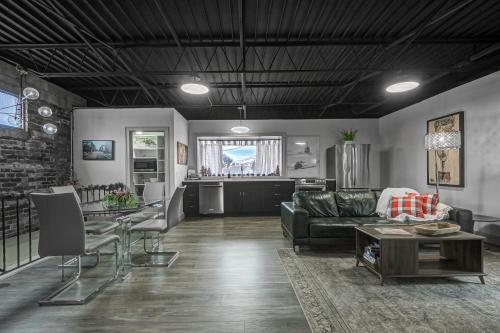 a living room with a couch and a table at The 418. An 1866 Build with Modern Comforts in Fort Wayne