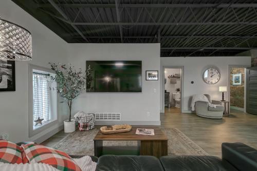 a living room with a couch and a table at The 418. An 1866 Build with Modern Comforts in Fort Wayne