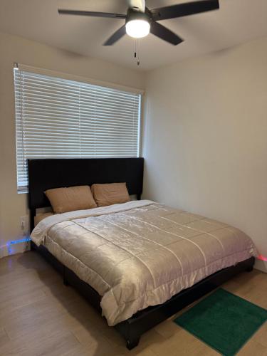 a bedroom with a bed with a ceiling fan at Home at Haven in Phoenix