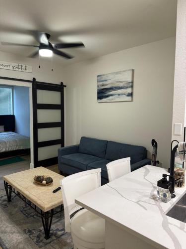 a living room with a couch and a ceiling fan at Home at Haven in Phoenix