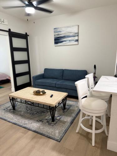 a living room with a couch and a table and chairs at Home at Haven in Phoenix