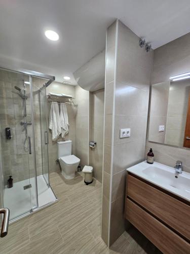 a bathroom with a shower and a sink and a toilet at Mataró Center Studio in Mataró