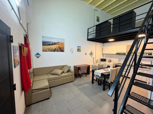 a living room with a couch and a table at Loft Neuquén in Neuquén