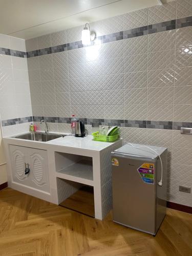 a bathroom with a sink and a trash can at Dailyroom C3,C4by Anna in Nonthaburi