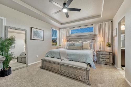 a bedroom with a bed and a ceiling fan at Selah Springs Lodge in Colorado Springs