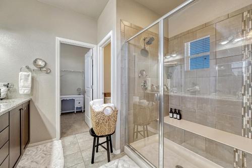 a bathroom with a shower and a glass shower stall at Selah Springs Lodge in Colorado Springs