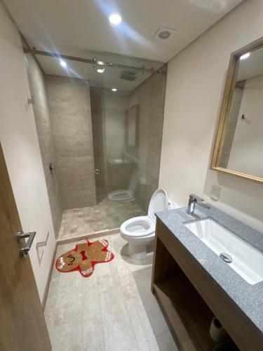 a bathroom with a toilet and a sink and a shower at Nima bay in Puerto Vallarta