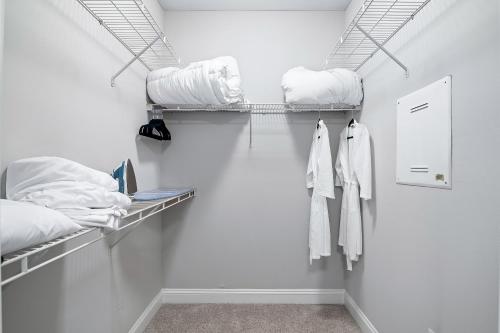a room with two bunk beds and white walls at Midtown King Bed Suite - Pool - Gym - Parking - Tennis Court in Atlanta