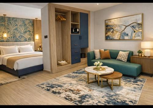 a hotel room with a bed and a couch and a table at The Nomad Pyramids Boutique Hotel in Cairo