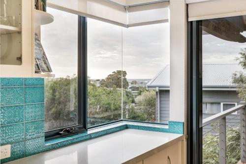 a kitchen with a large window and a bath tub at Ocean Blue - Gnarabup NEW in Gnarabup