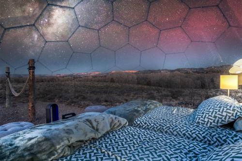 a bedroom with two beds and a starry sky at Brycegate Retreat. Stunning Views. Modern Comforts. in Hatch