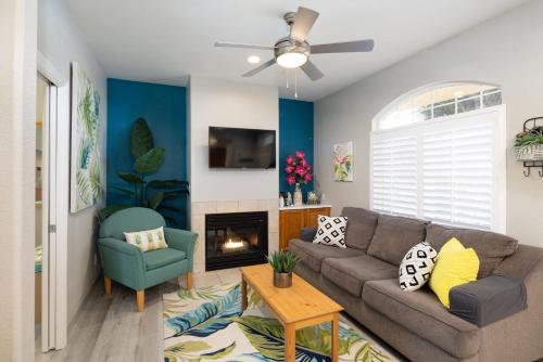 a living room with a couch and a fireplace at Seaside Flamingo Retreat in Oceano