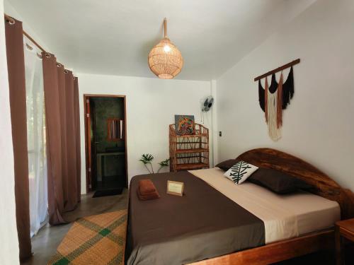 a bedroom with a large bed in a room at Payapa garden Nagtabon Beach in Puerto Princesa City