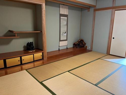 a living room with a large room with a table at Fukuzawa Ryokan - Vacation STAY 39918v in Sakai