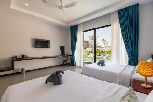 En eller flere senger på et rom på Blanc Smith Private Villa