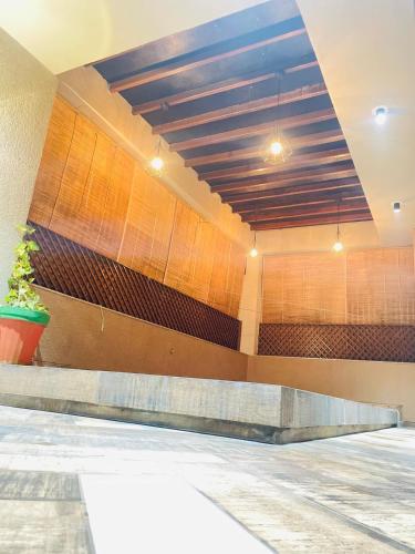 a lobby of a building with a ceiling at Nisarg’s stays in Ahmedabad