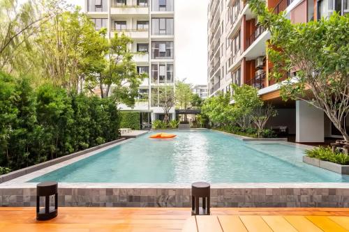 an infinity pool in the middle of a building at Tierra Residences in Bangkok in Bangkok