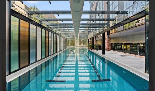 an empty swimming pool in a building at Cozy 1BR Apt pet free, free parking Kingston in Kingston