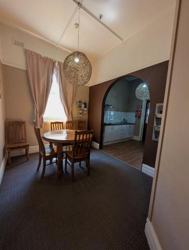 a dining room with a table and chairs at Balcony On Sixth Lodge in Murray Bridge