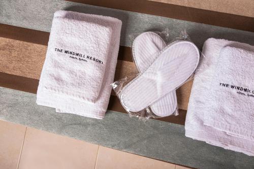 a pair of towels with a heart on them at The Windmill Resort in Mitáta
