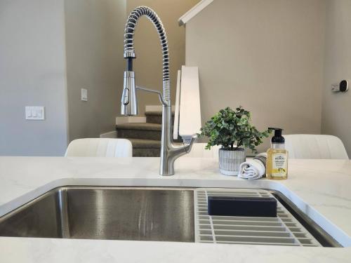 a kitchen sink with a faucet on a counter at Harmony Haven in Drumheller in Drumheller