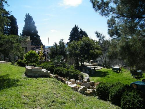 a garden with rocks and trees on the grass at Agriturismo Sorgente di Luna in Larino